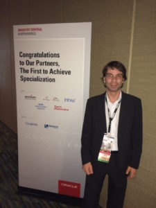 Ricardo Riguera, Order Management BU Director next to the Specialization Program Billboard during last Oracle Open World in San Francisco